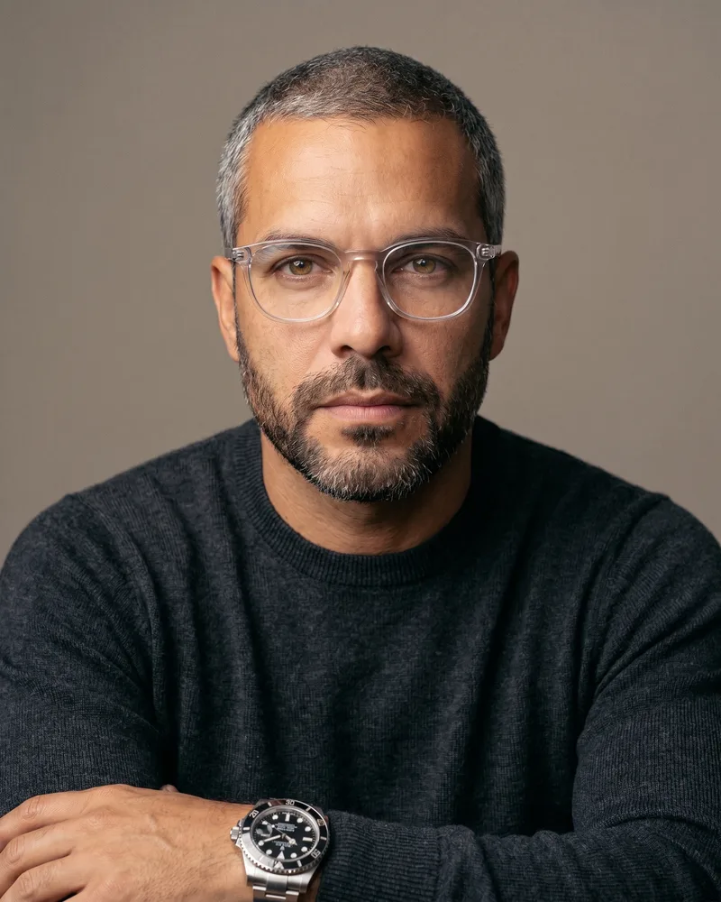 A clean studio headshot of the custom AI avatar, the still-image surface of one saved identity, rendered by the Playcut Actor Engine
