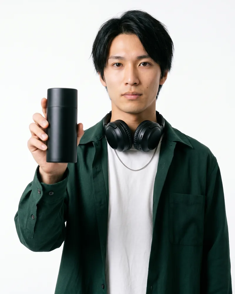 An AI UGC creator holding an unbranded product to camera in a sponsored-post style clip, the on-product format brands use AI UGC for, rendered by the Playcut Actor Engine